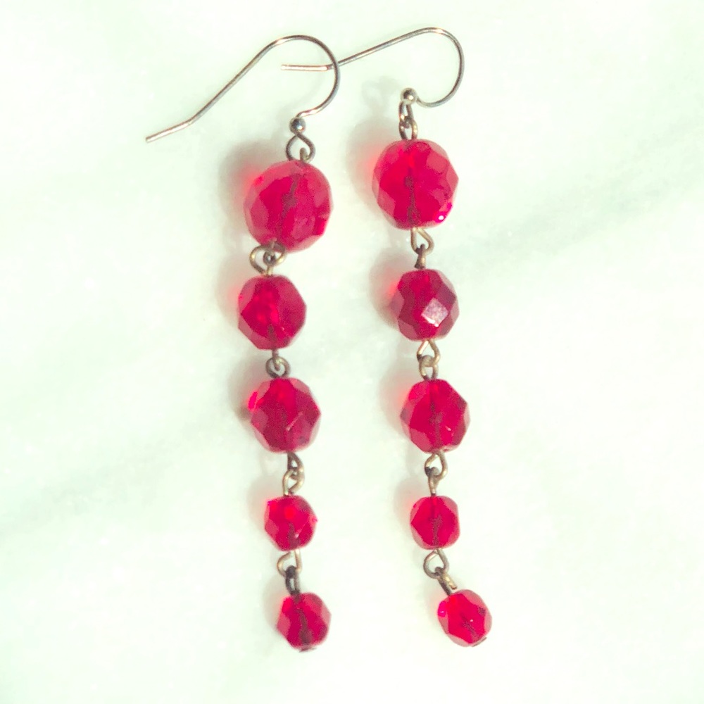 Ruby red sparkling dangle fashion earrings.